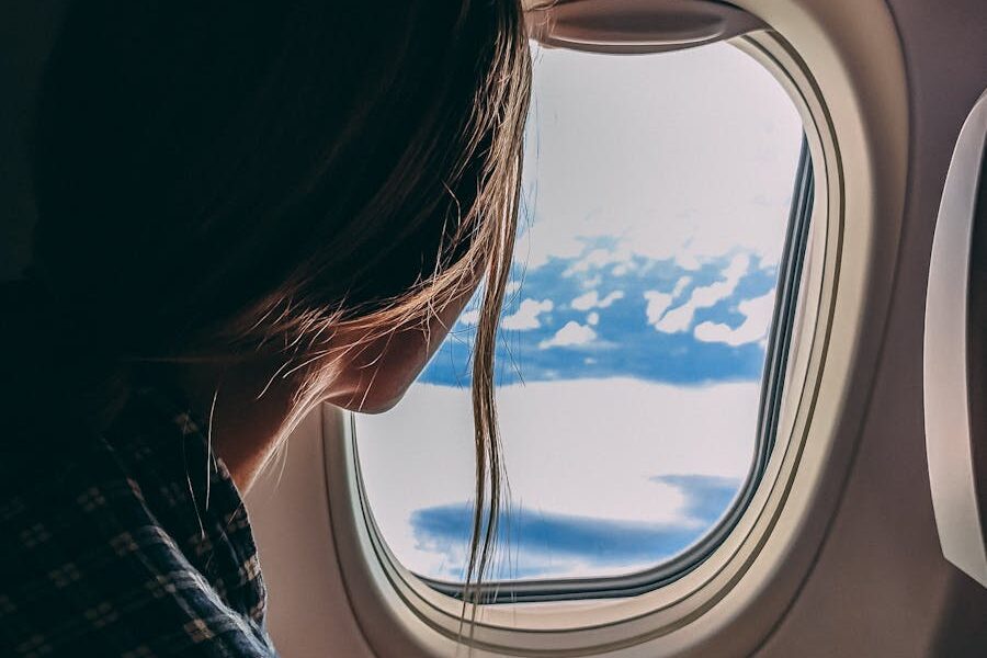 Person Holding Smartphone Riding Airplane